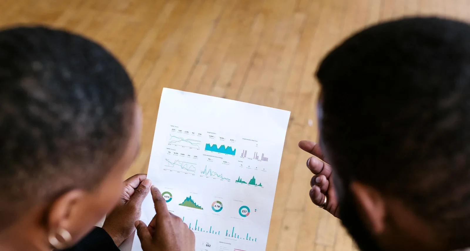 African professionals reviewing a performance dashboard